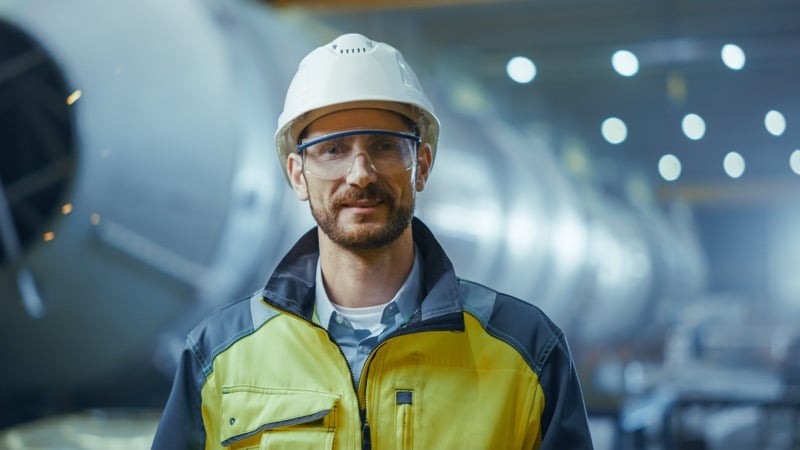 Engineer in hard hat in a factory